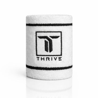 Thrive Pickleball white 4-inch athletic wristband with black embroidered logo and striped detailing for sweat absorption